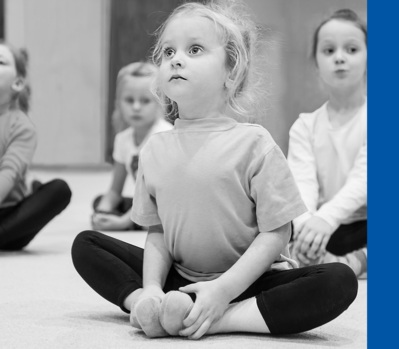 Image of a kid stretching class